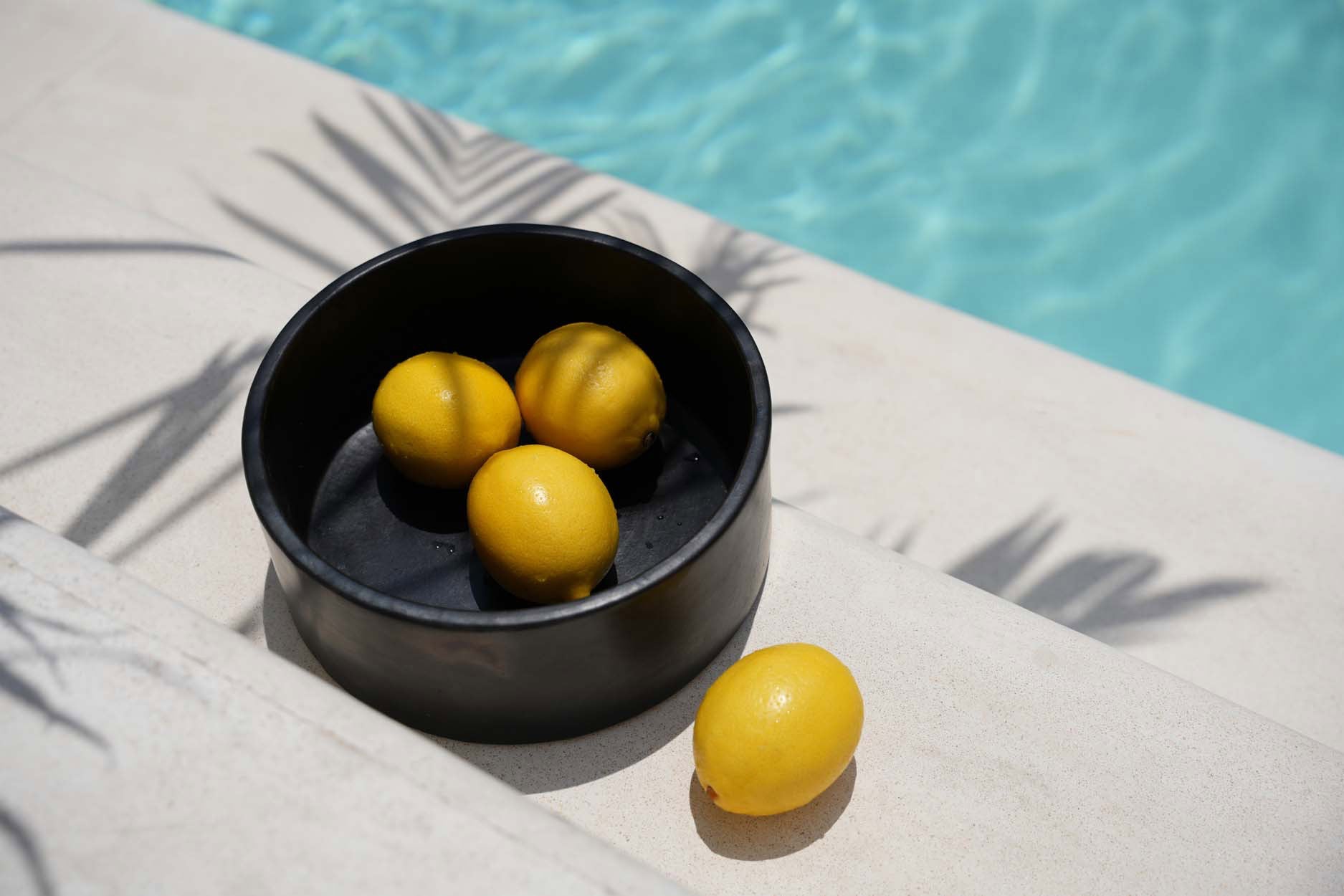 Three-piece black cylinder dish set, modern ceramic design ideal for casual dining or festive gatherings.