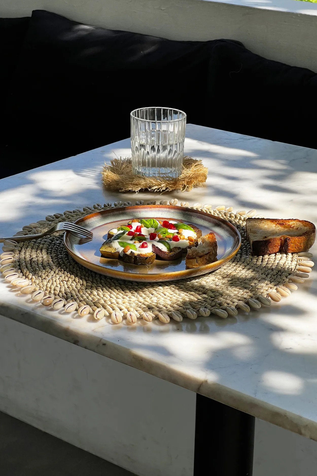 Artisan-crafted handmade placemat, ideal for boho or seaside-inspired interiors and everyday meals.