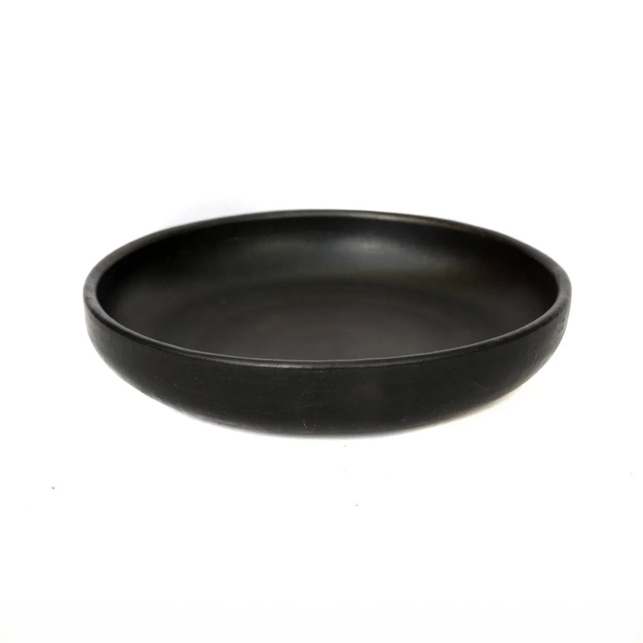 The Burned Deep Plate medium size, handmade black terracotta dinnerware for modern dining.