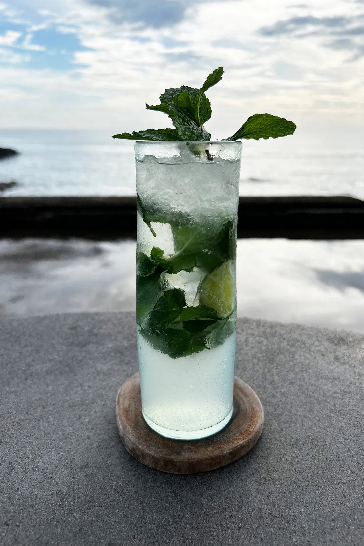 Solid teak root coaster with natural texture, adding warmth and character to bohemian or Nordic interiors.