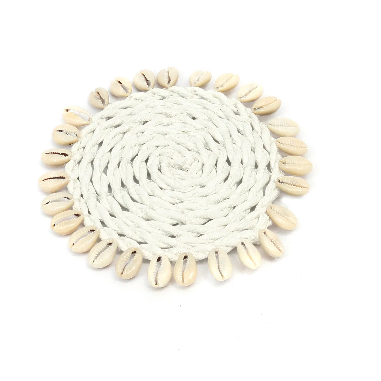White coaster handcrafted from seagrass with delicate shell accents, perfect for adding natural charm to any table.
