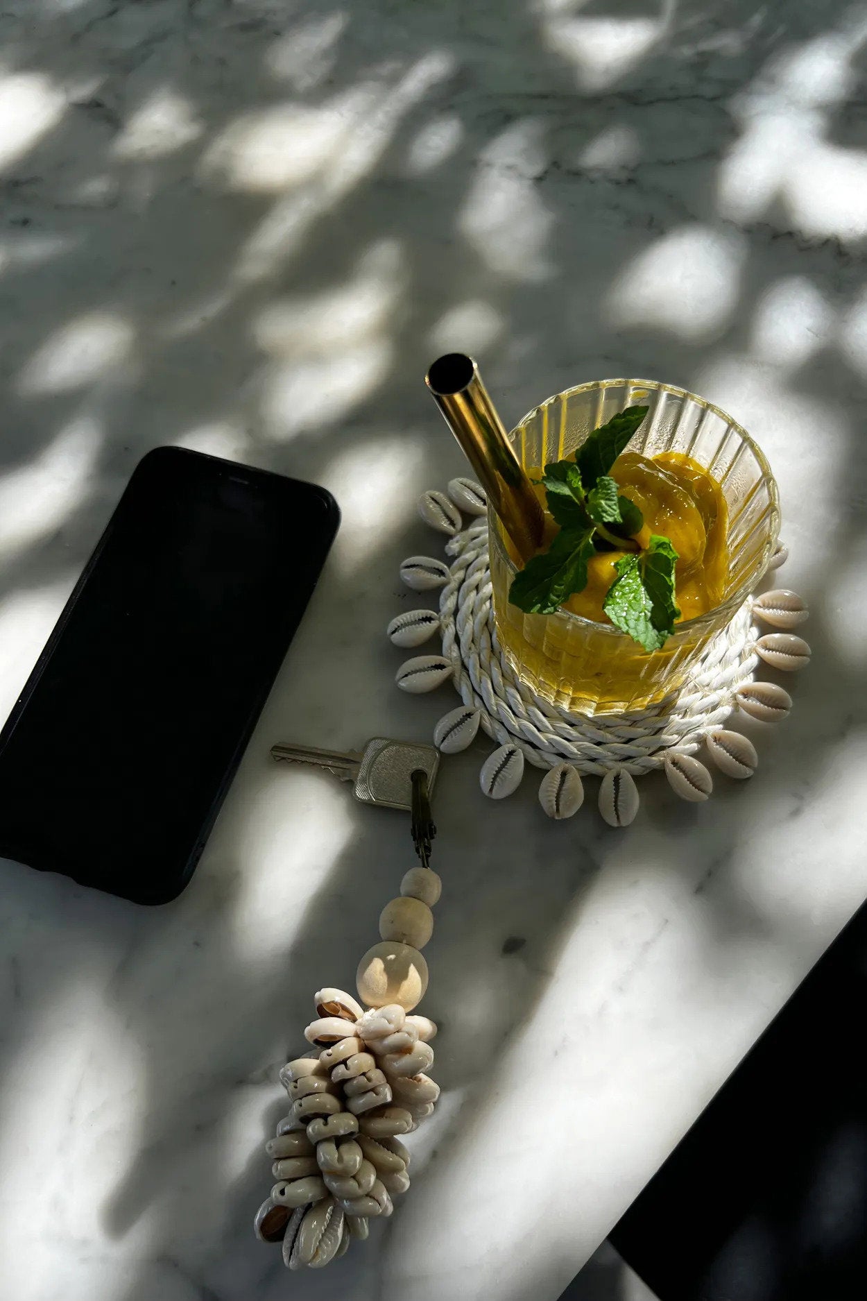 Artisan-crafted seagrass coaster in white, featuring slight variations in color and texture for a unique look.