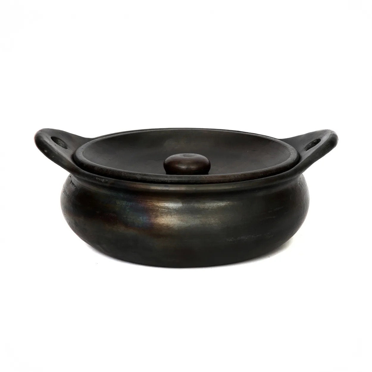 The Burned Pot in black, handmade terracotta ceramic pot for cooking and serving.