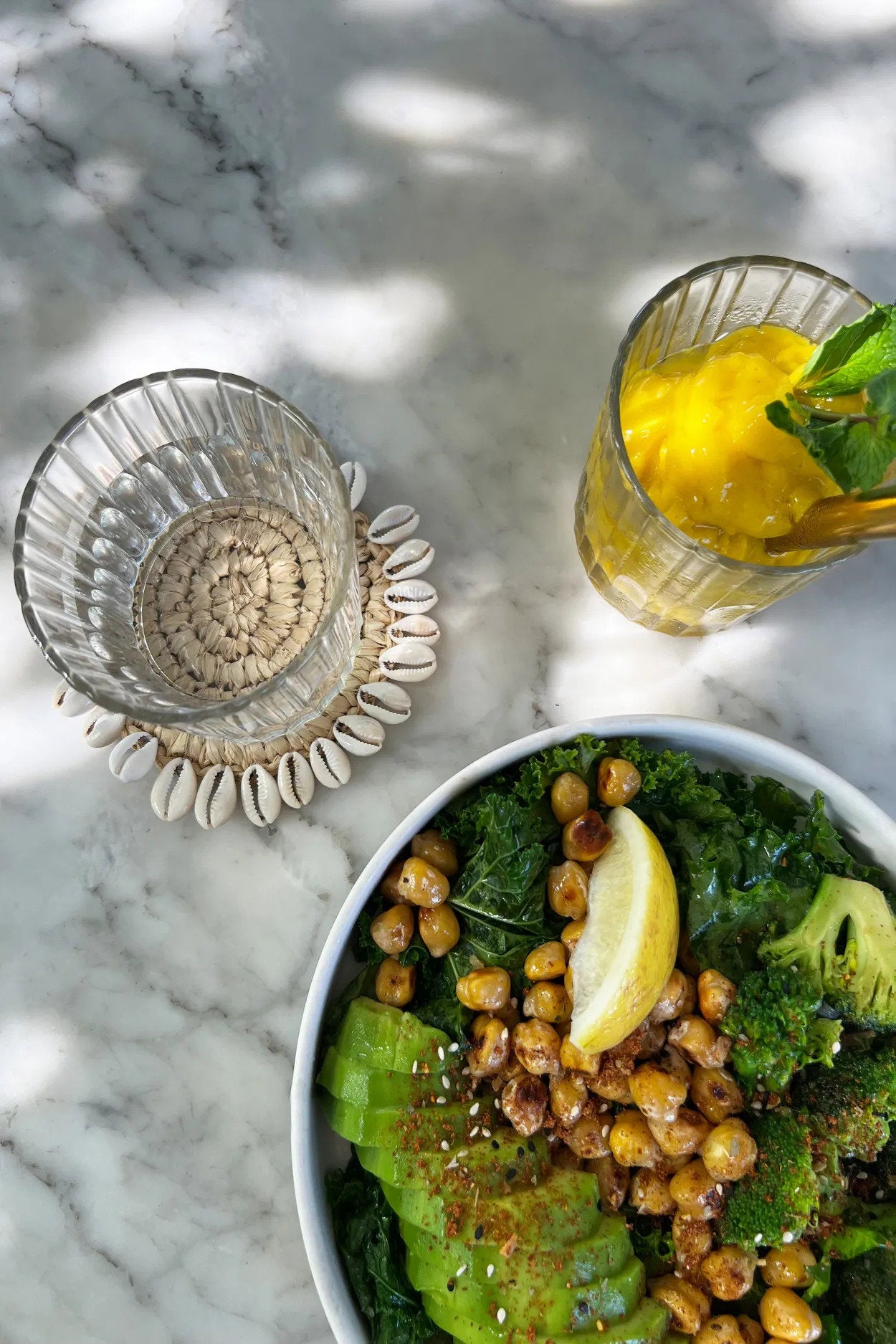 Eco-friendly coastal shell coaster made from durable seagrass, combining function with island-inspired style.