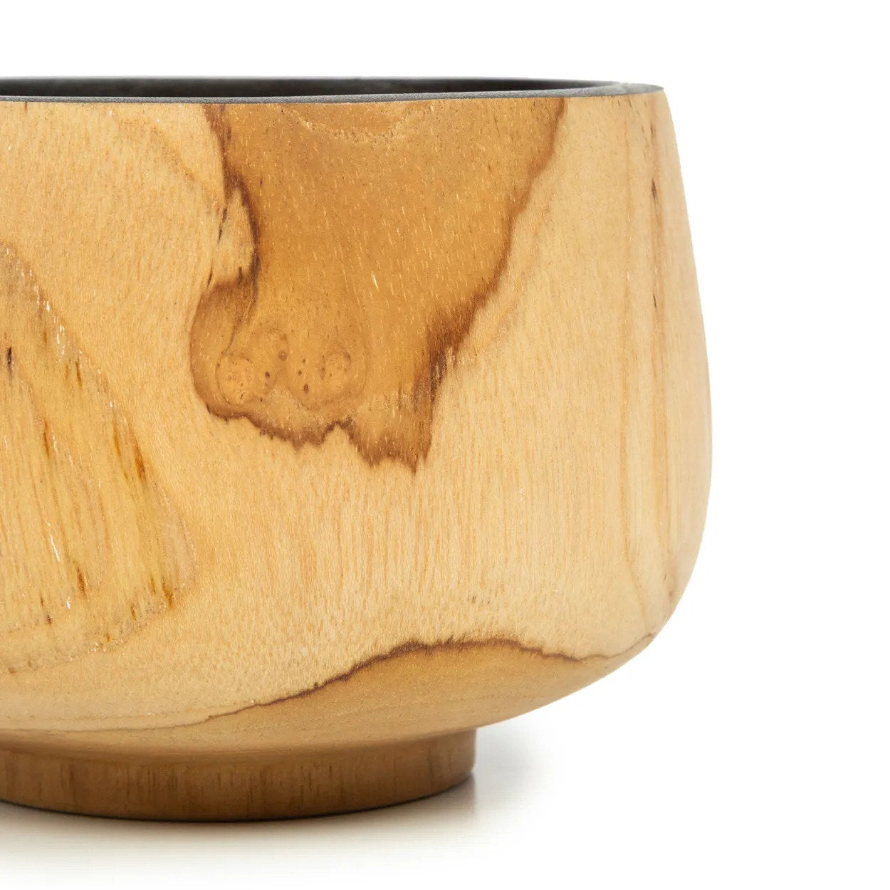 Artisan-made natural teak bowl, each piece unique with subtle variations in tone and texture.