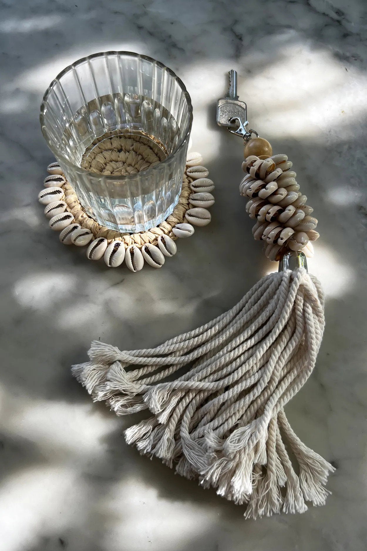 Durable handmade raffia coaster, perfect for protecting tables from spills while adding organic texture.