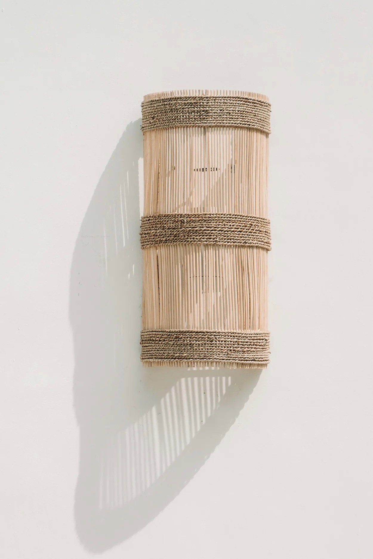 Close-up view of The Jalal’s woven rattan texture, showcasing natural variations and the handcrafted details of each piece.