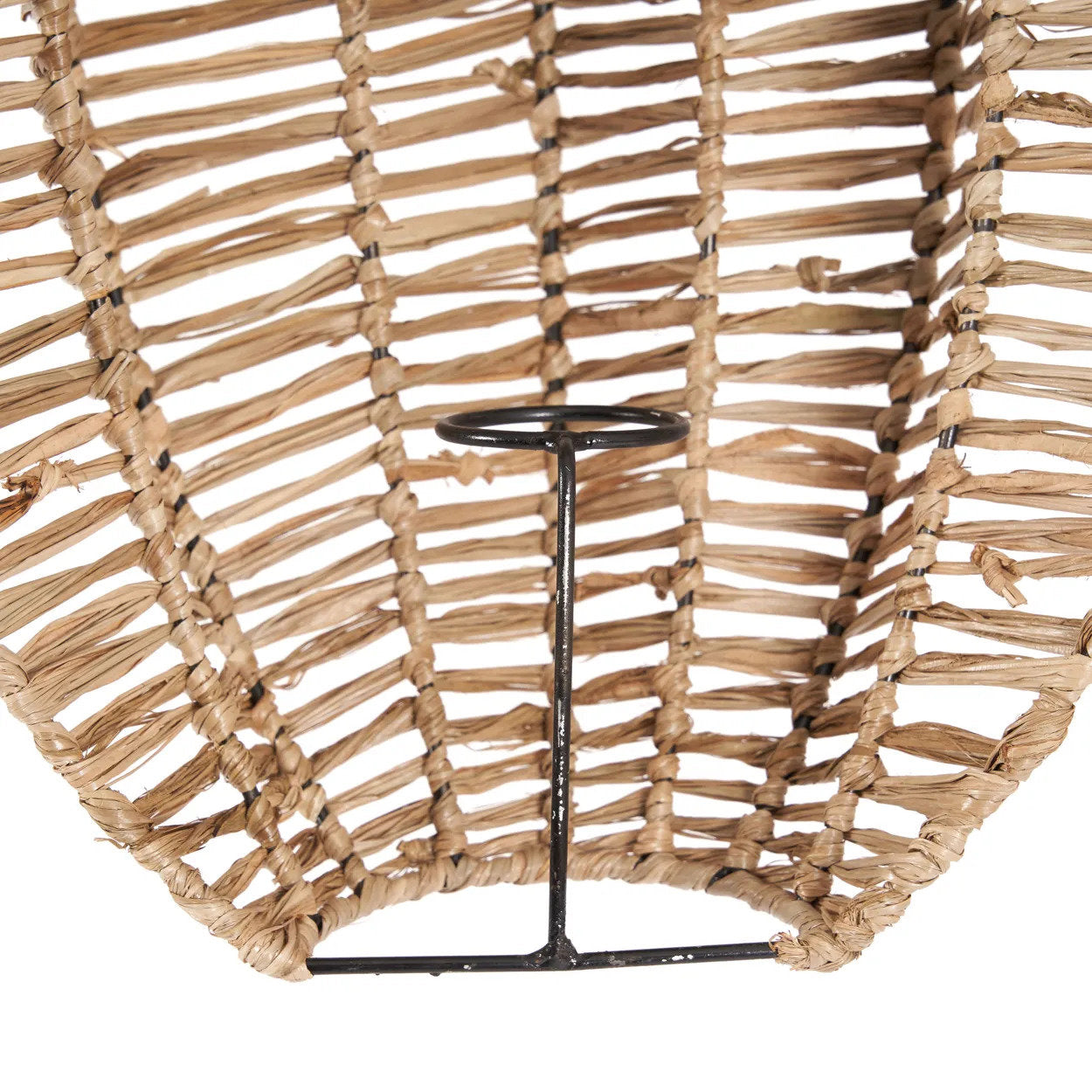 Handmade raffia wall sconce styled in a relaxed, beach-inspired living space, adding warmth and natural charm.