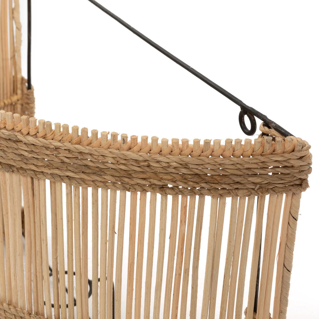Medium-sized rattan wall light shown in a coastal-themed interior, blending seamlessly with neutral tones and wood accents.