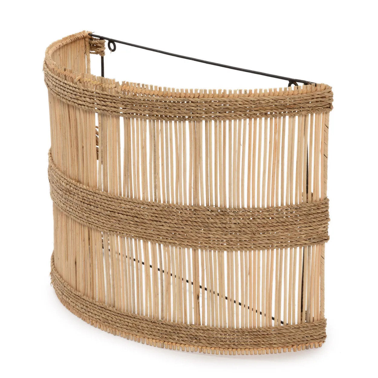 Natural rattan wall lamp mounted in a hallway, casting soft decorative light and adding organic charm to the space.