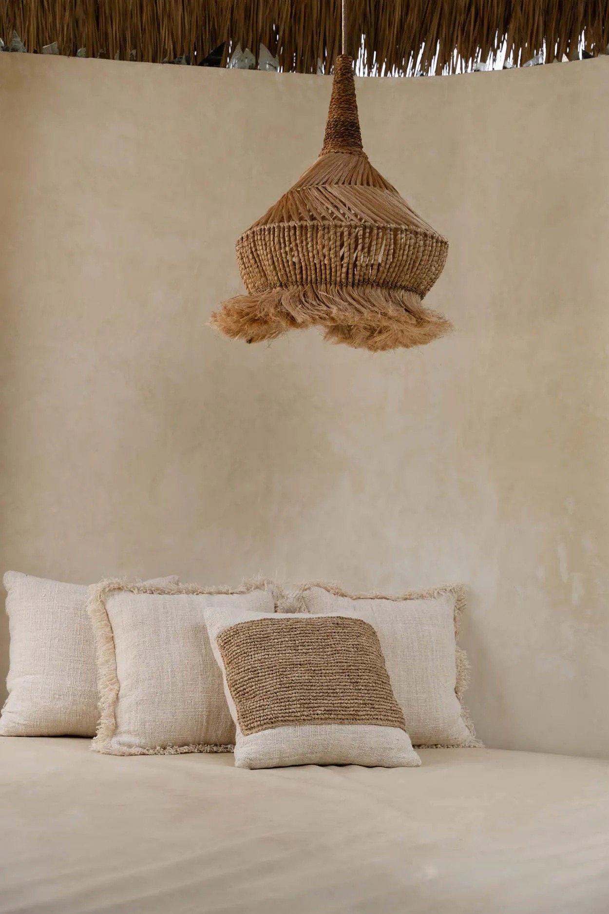 Elegant raffia and cotton cushion cover for a cozy, bohemian vibe