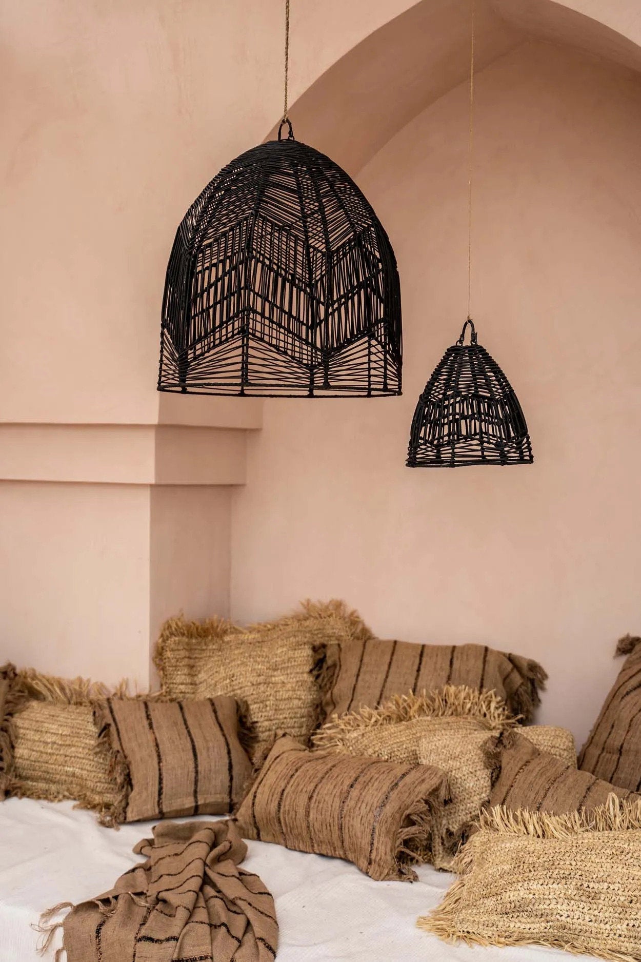 Square raffia cushion cover in natural color, great for garden or living room.