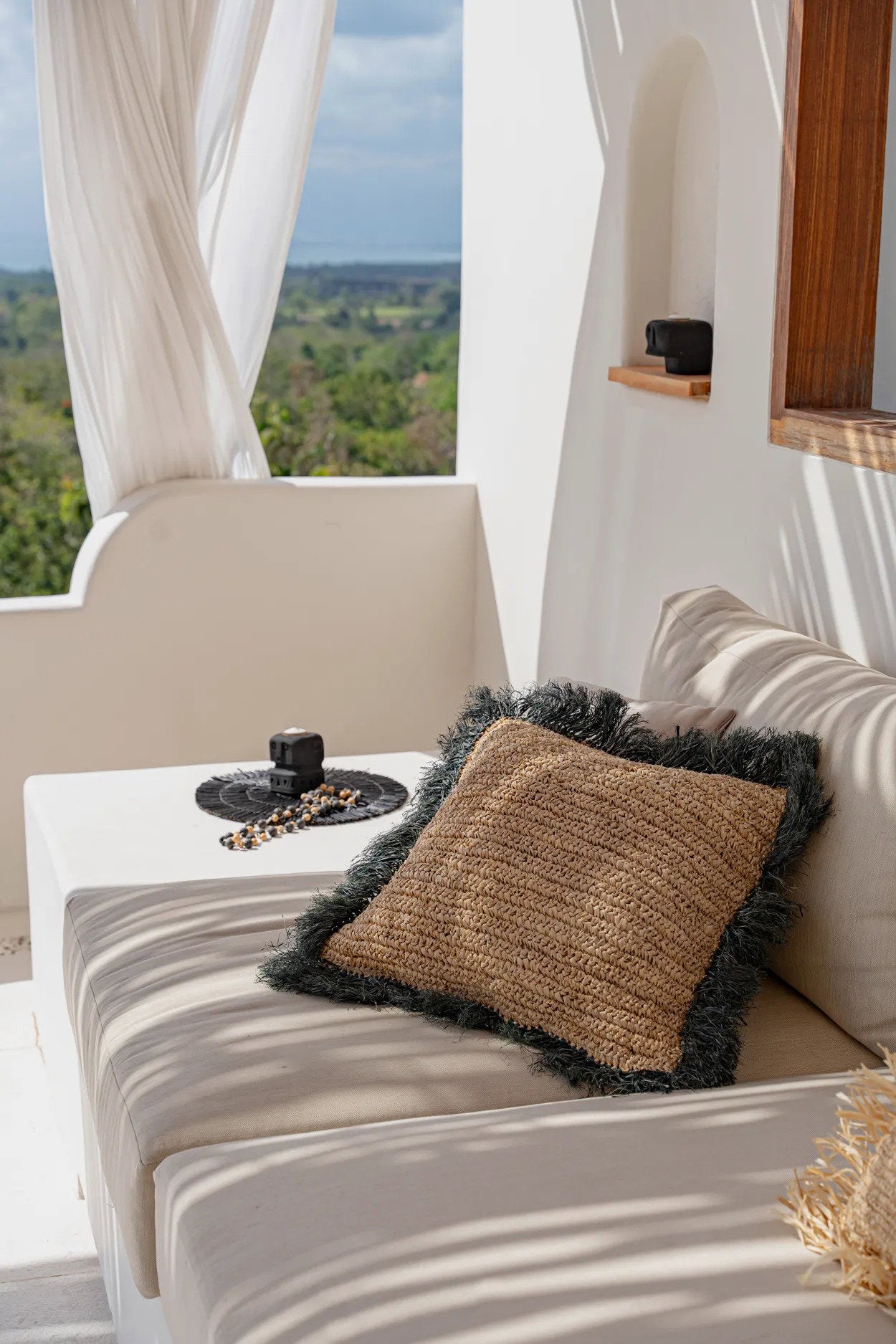 Eco-friendly 60x60 natural black raffia cushion cover, perfect for sofas and gardens