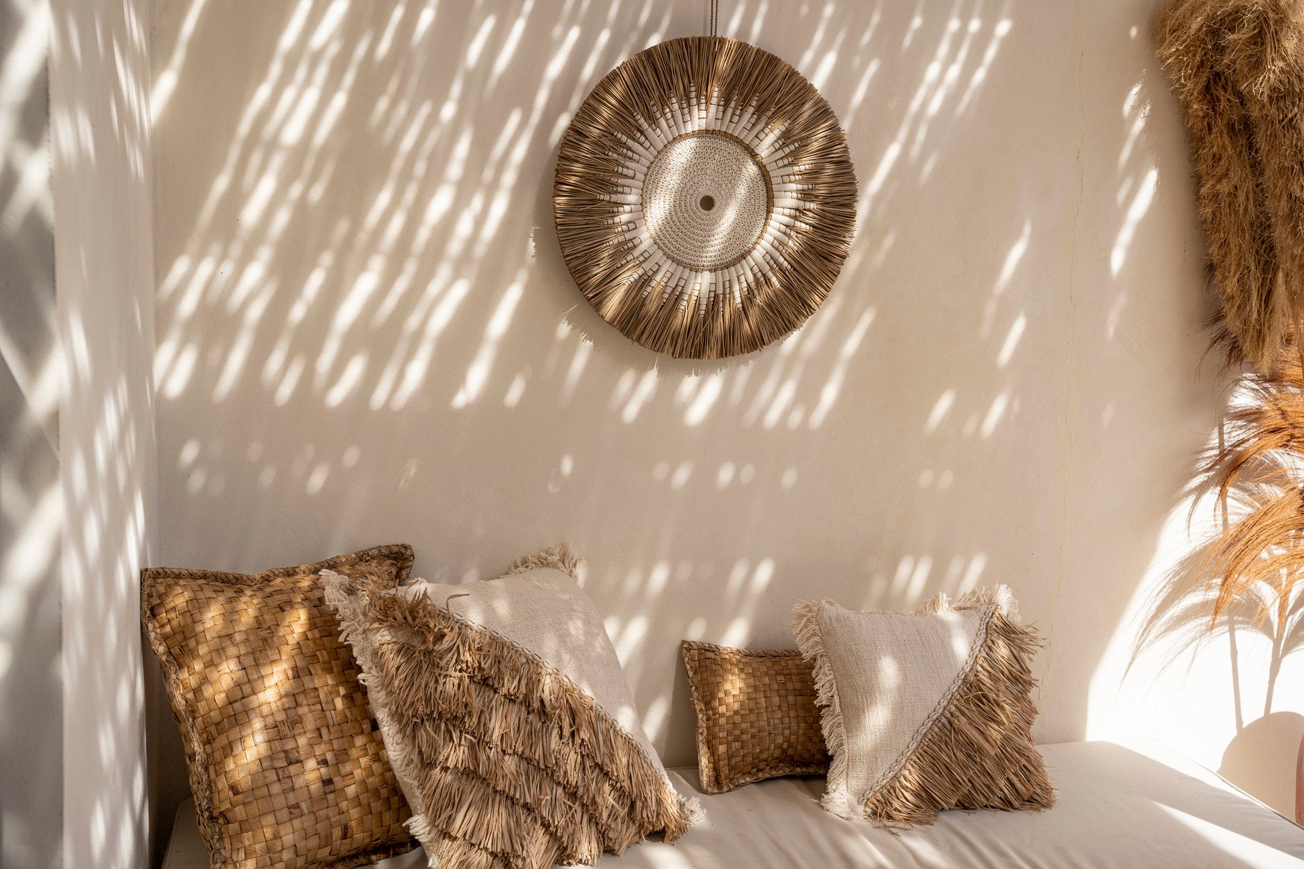 Soft cotton cushion cover with raffia fringes for a stylish sofa