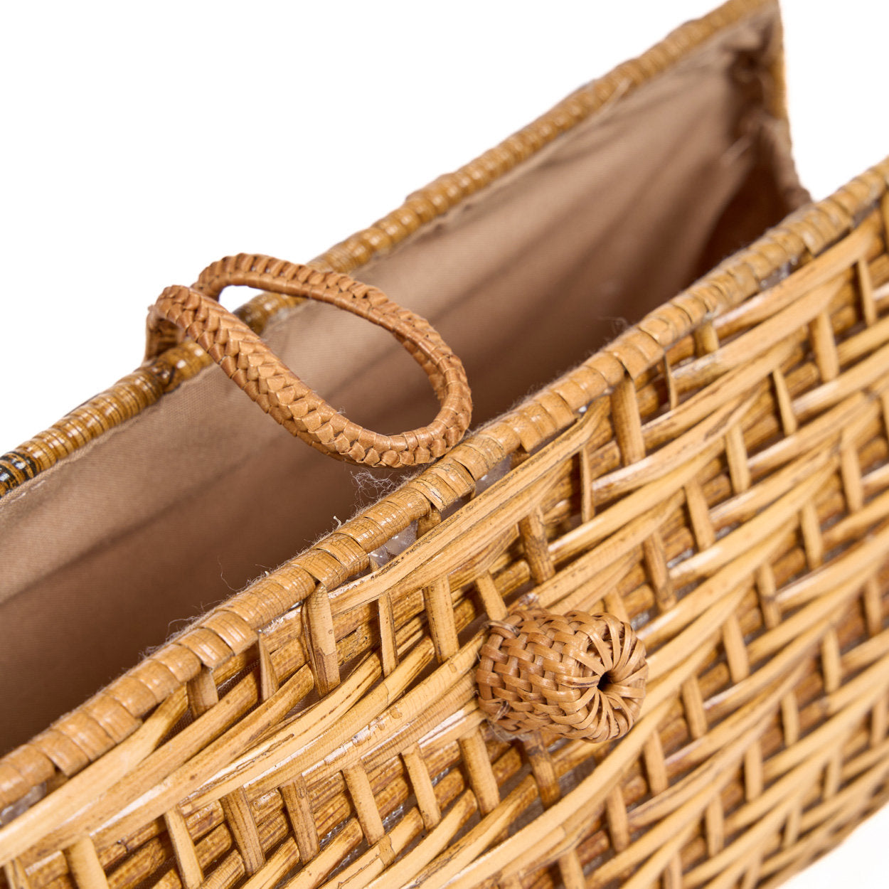 Compact woven clutch bag in natural fibers, perfect for carrying essentials with a chic boho touch.