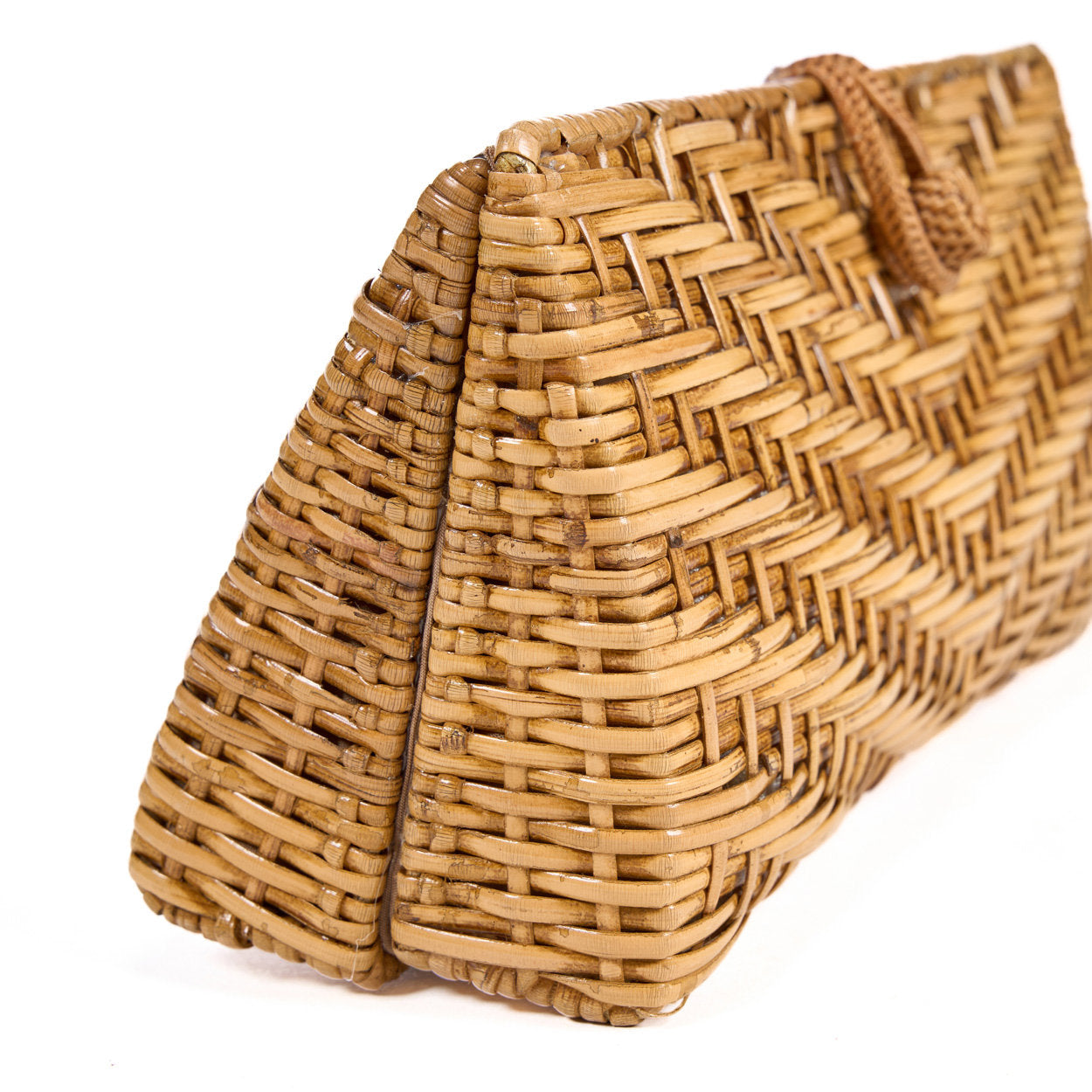 Elegant natural raffia clutch bag, showing soft texture and compact design, ideal for sustainable fashion lovers.