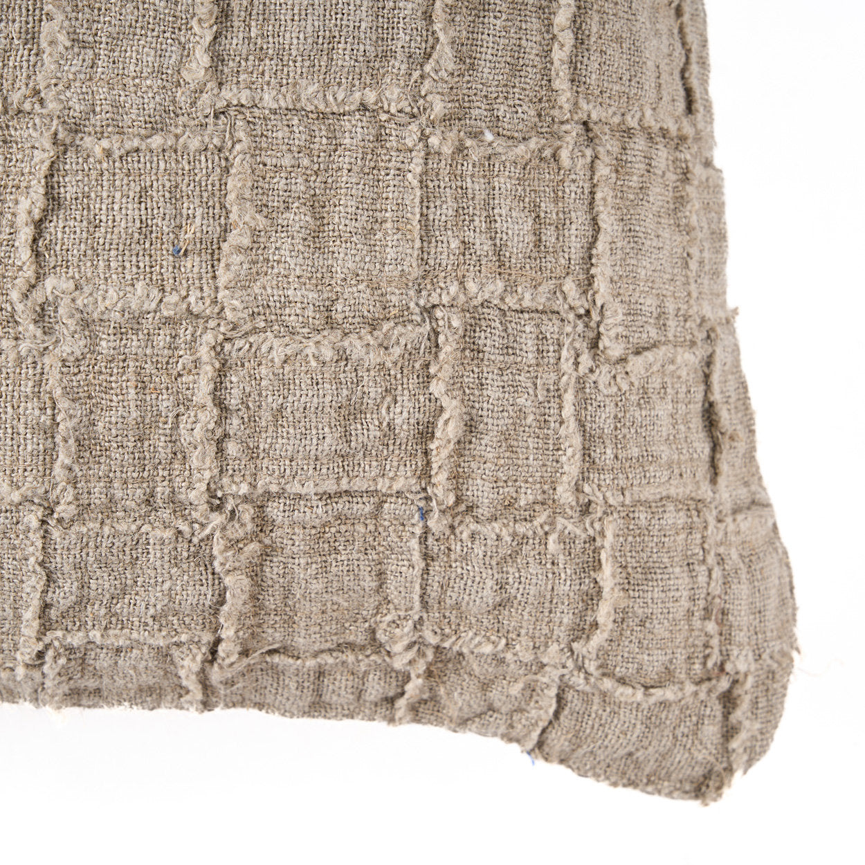 Decorative linen cushion cover with subtle checkered weave, versatile for boho or modern interiors.