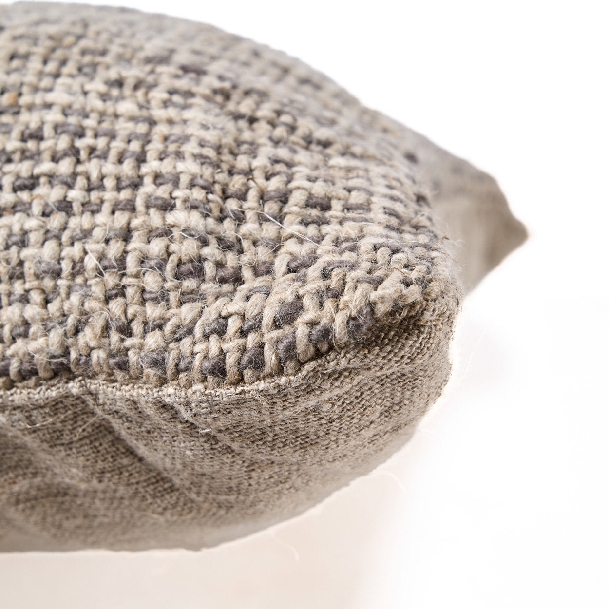 Artisan-crafted black linen cushion cover with subtle textured weave, soft and breathable