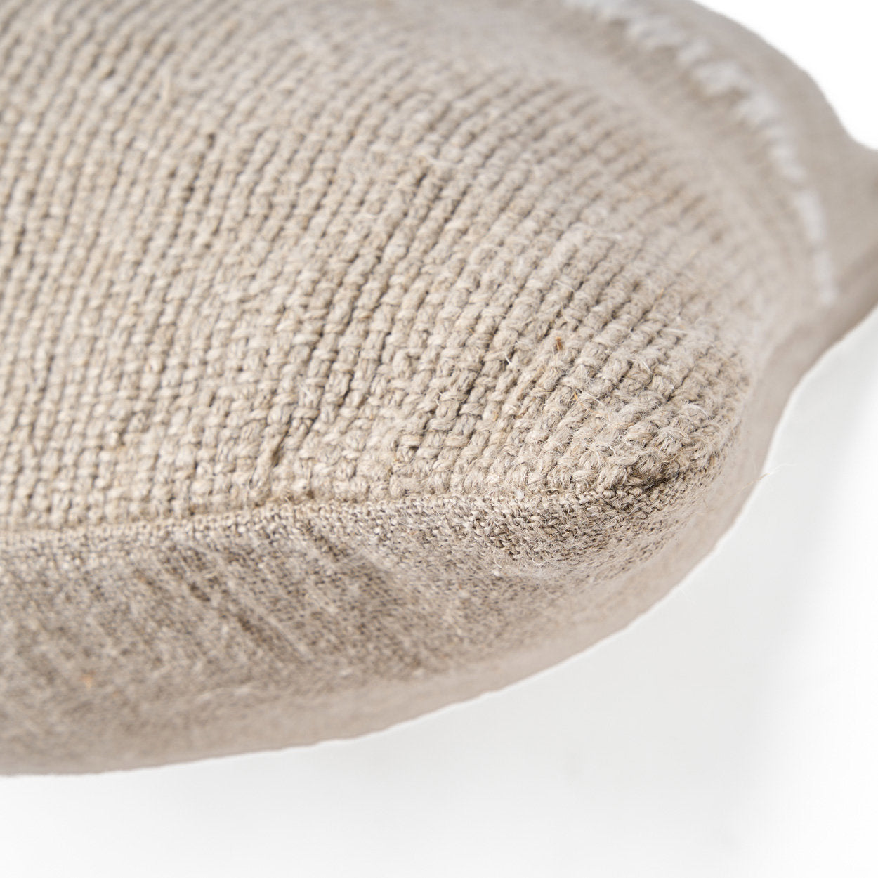 Artisan-crafted white linen cushion cover with decorative stitch detailing, soft and breathable