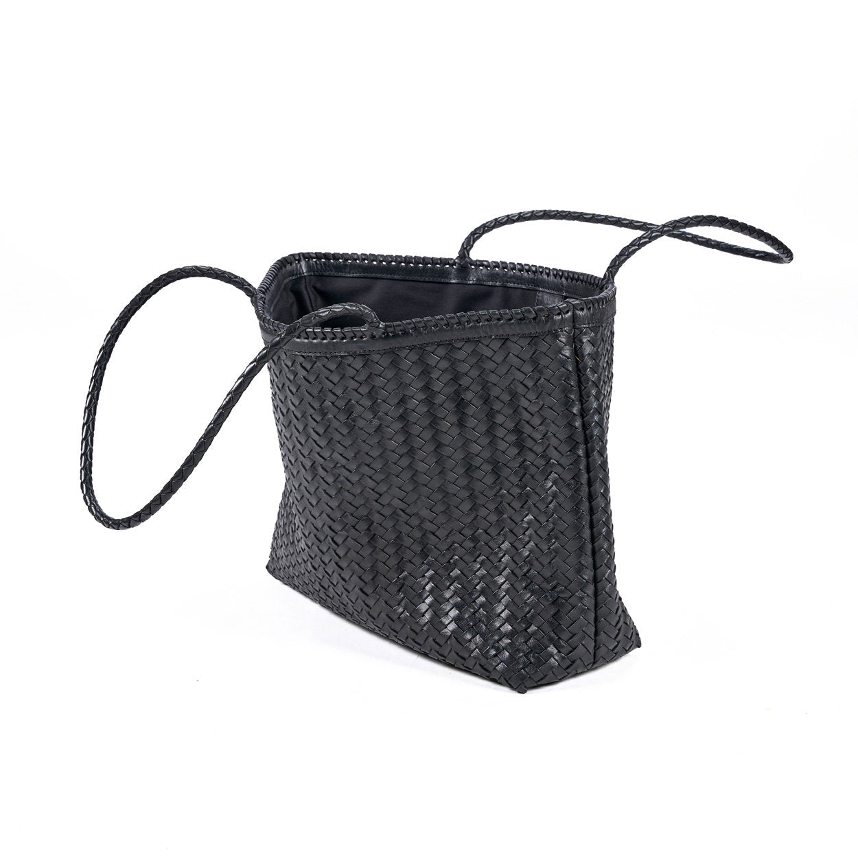 Minimalist black leather tote bag with refined stitching and structured design