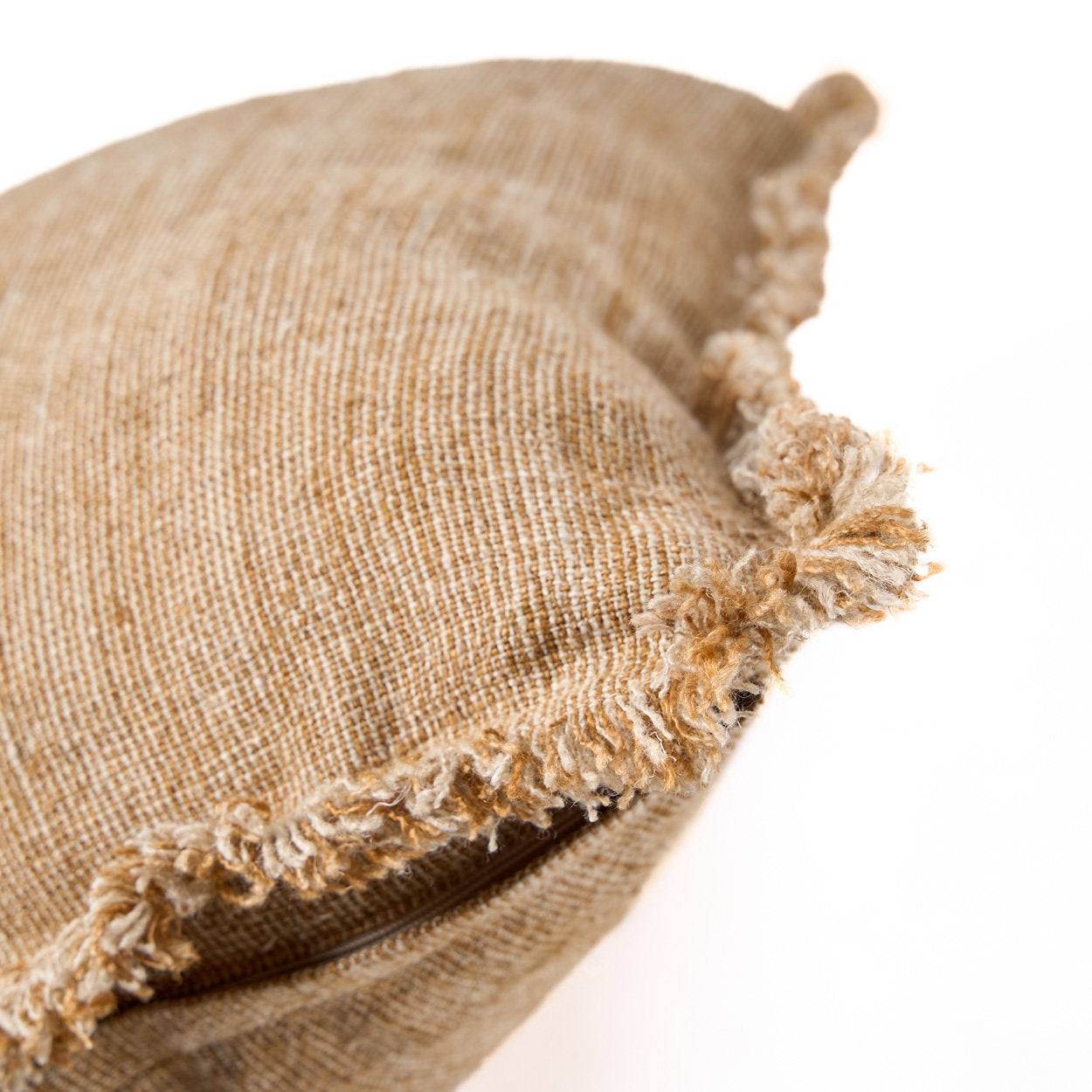 Artisan-made brown linen cushion cover with decorative fringe, soft and breathable for sofas or chairs