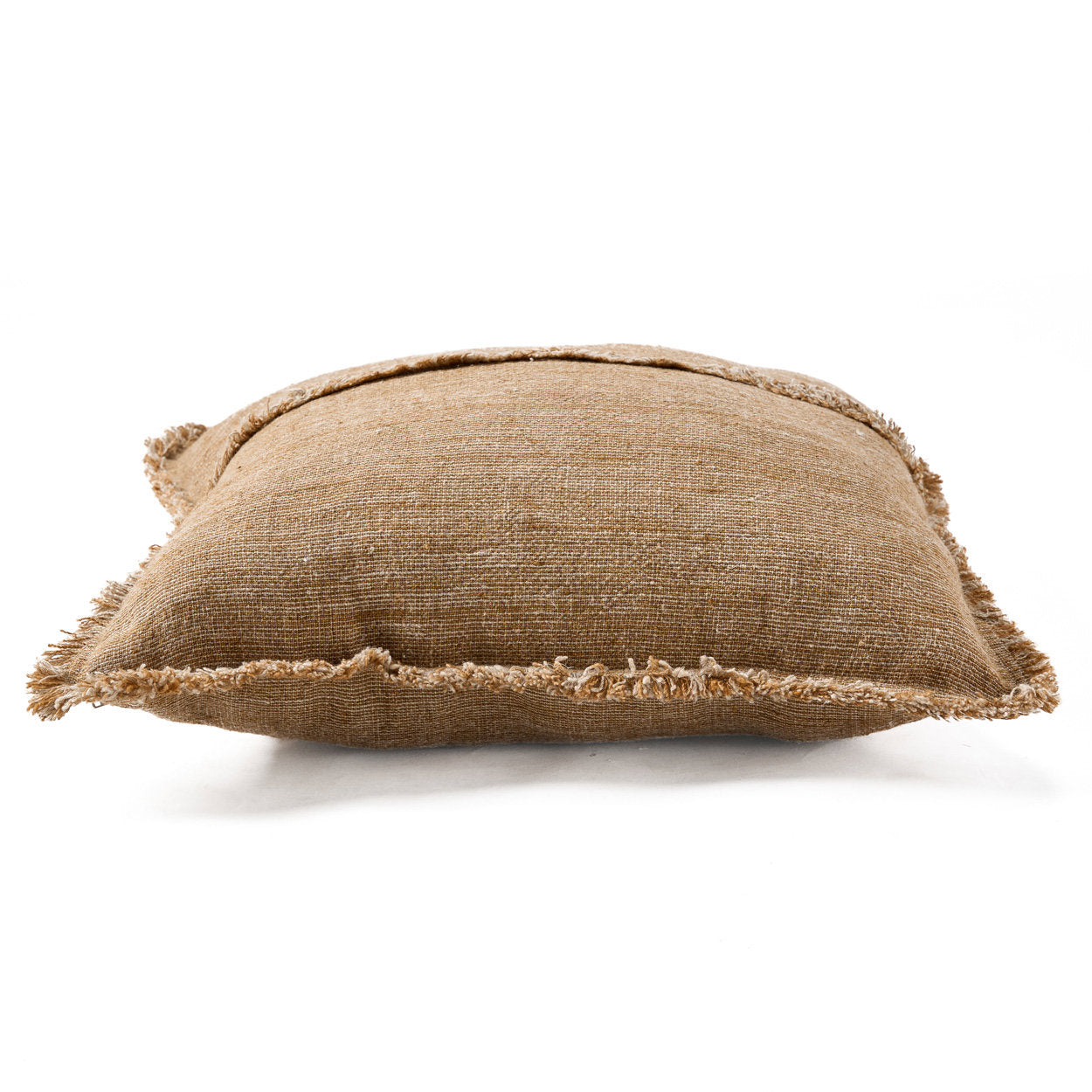 Earthy-toned linen cushion cover with fringe, perfect for cozy living spaces