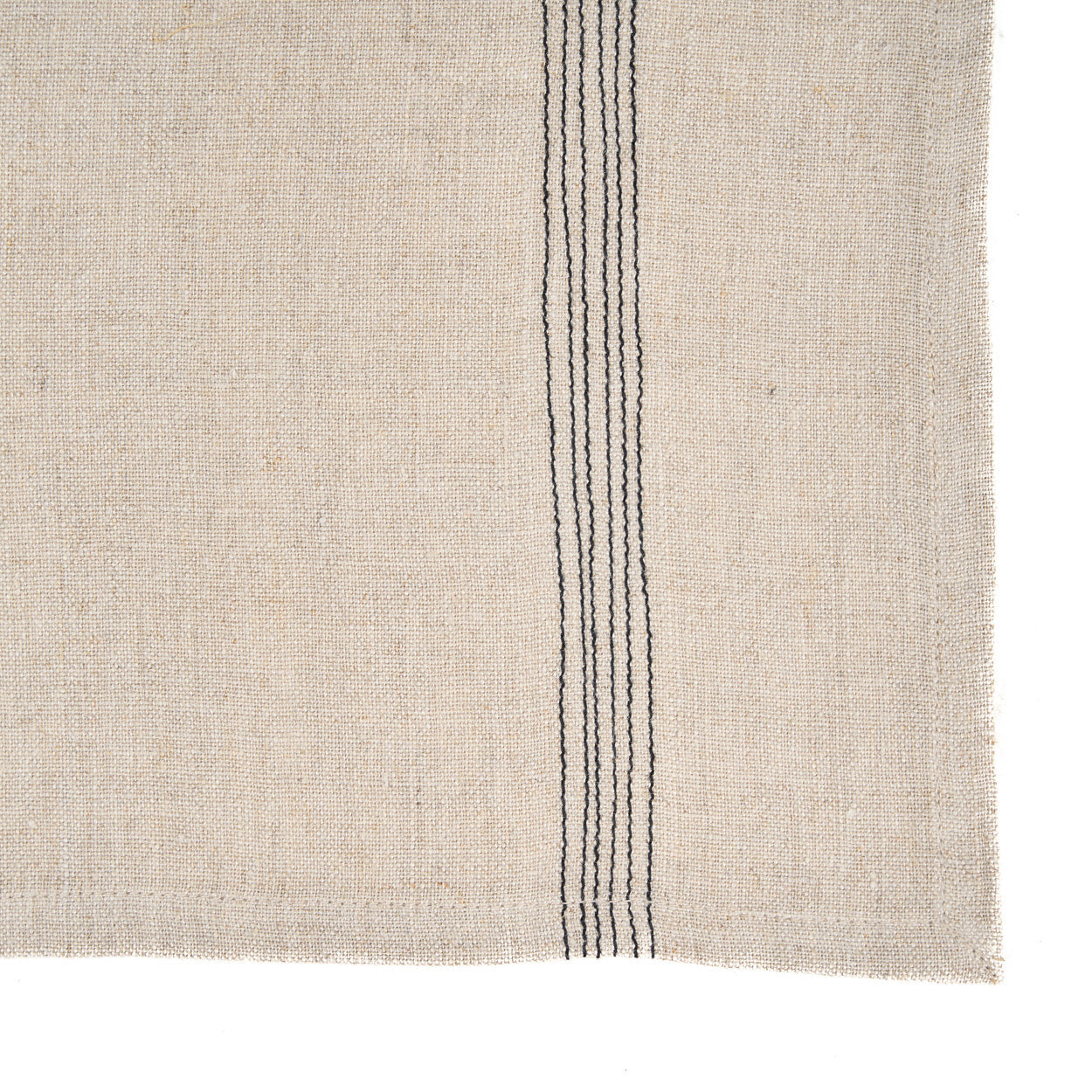 Folded 45x45 cm Lint Biscuit Napkin displayed on a wooden picnic table, ideal for outdoor gatherings or casual meals.