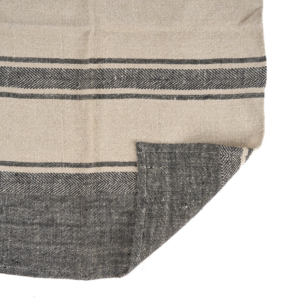 Boho-inspired linen towel with black smudge stripes, adding warmth and texture to any kitchen space.