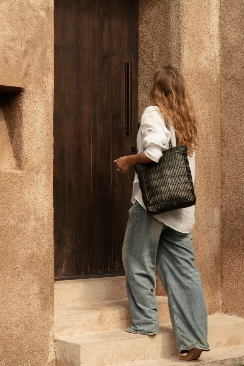 Chic black leather tote with roomy interior for daily essentials