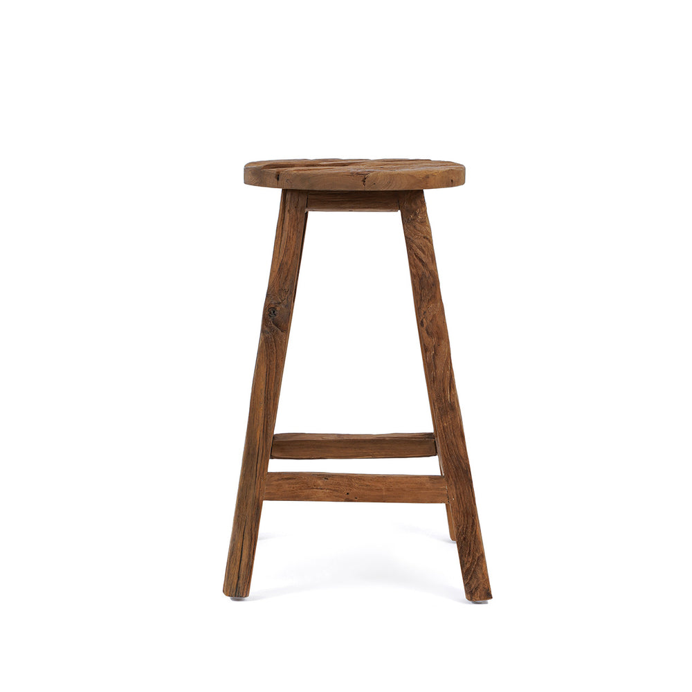 A rustic breakfast bar stool from reclaimed teak wood, handcarved in Indonesia with natural texture.