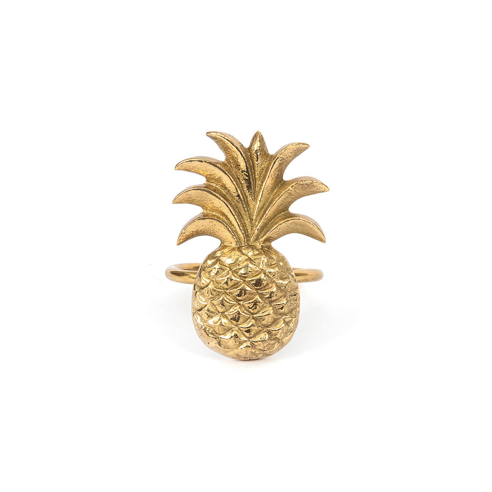 Brass napkin ring with stylized pineapple motif in golden tone.