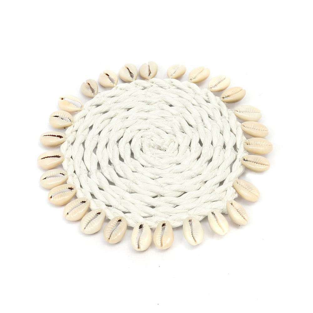 White coaster handcrafted from seagrass with delicate shell accents, perfect for adding natural charm to any table.