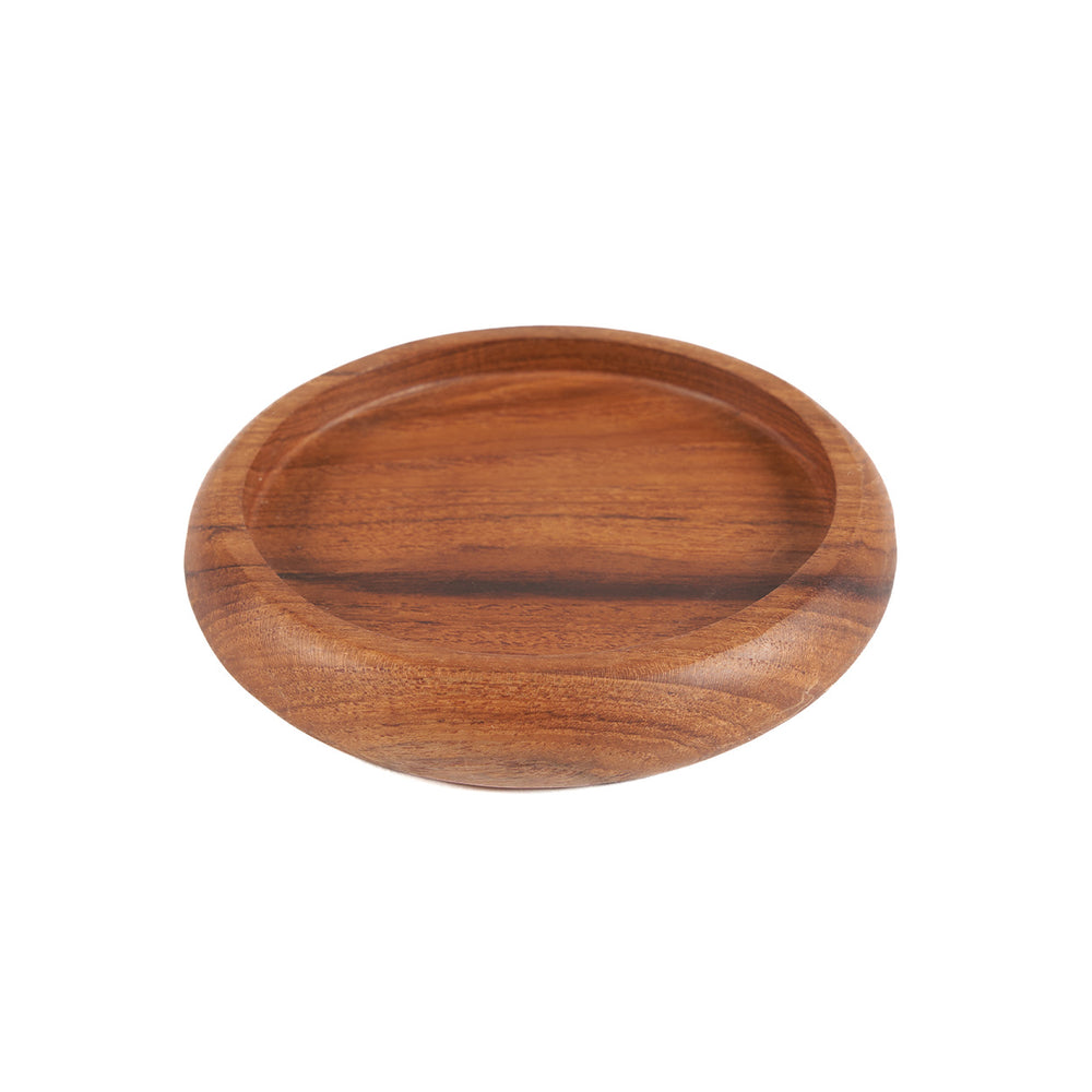 Handcrafted teak coaster with smooth surface, perfect for protecting tables while adding a touch of luxury.