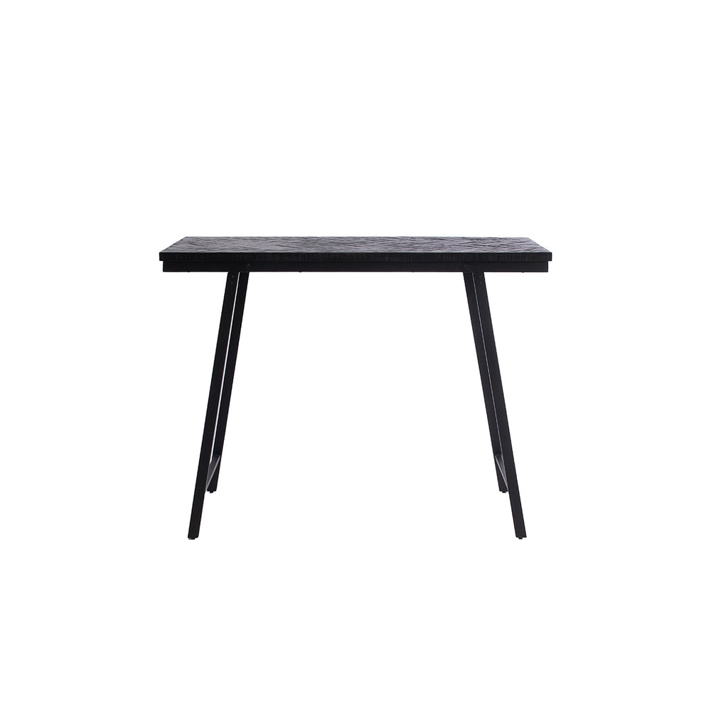 A slender teak and iron high table featuring a herringbone mosaic pattern in black.