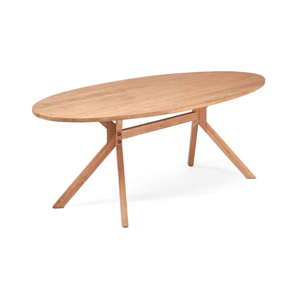 An oval dining table featuring a dynamic, splayed trestle-style base with tapering legs.