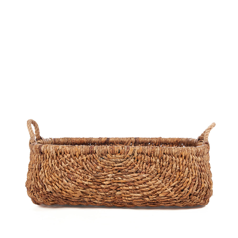 A large woven basket crafted from iron and wrapped in banana leaf fibres, finished with looped handles.