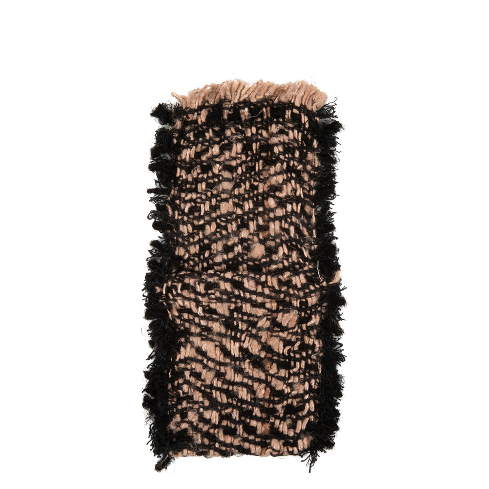 A handwoven cotton cutlery holder in black and copper color for a neat tabletop