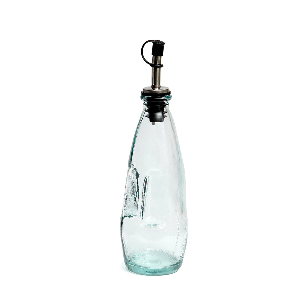 Oil dispenser with subtle blue tint, handmade from recycled glass.