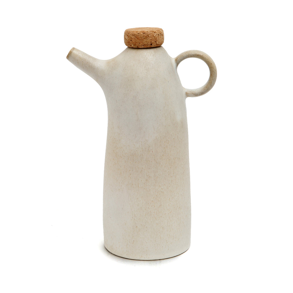 White ceramic olive oil bottle with natural cork and elegant form.