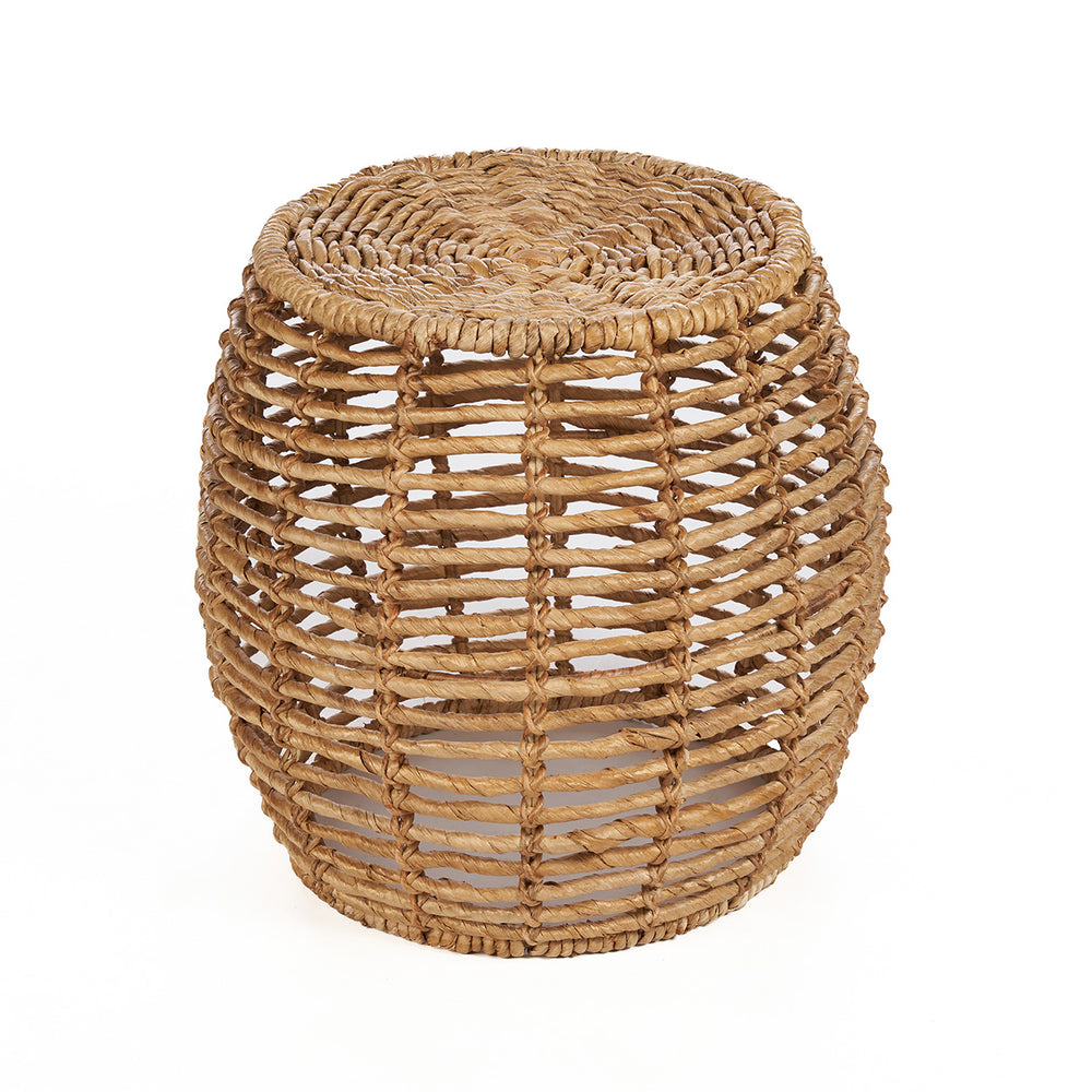 A natural round sitting stool with a gently tapered top and bottom, handmade from banana leaf and sturdy iron.