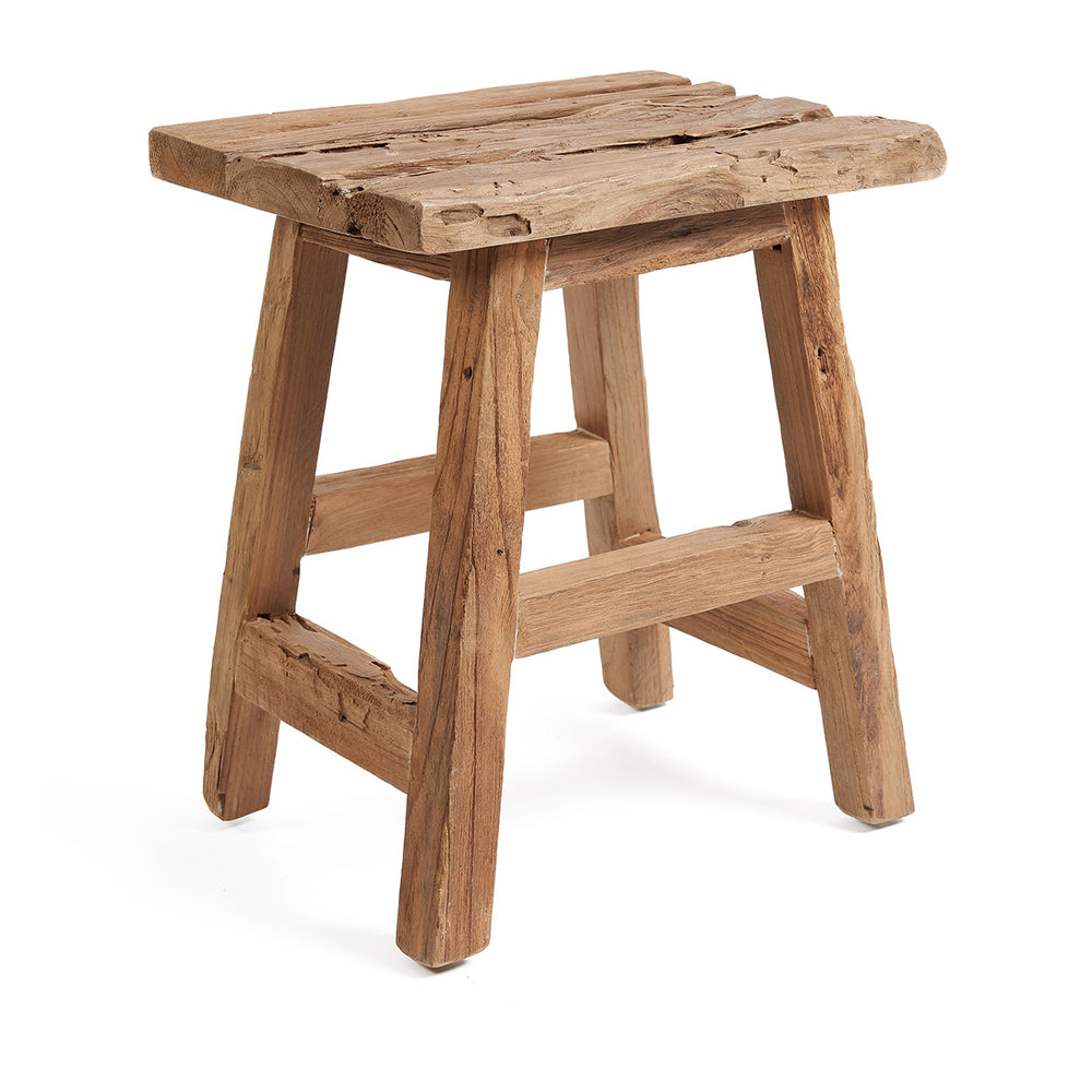 A solid wood stool from reclaimed teak wood with natural, rustic textures. Designed with four feet and footrest.