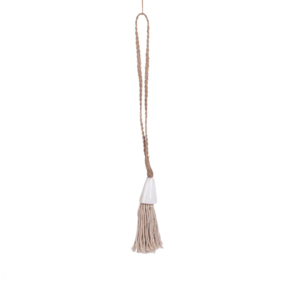 A seagrass and shell necklace with a tassel.