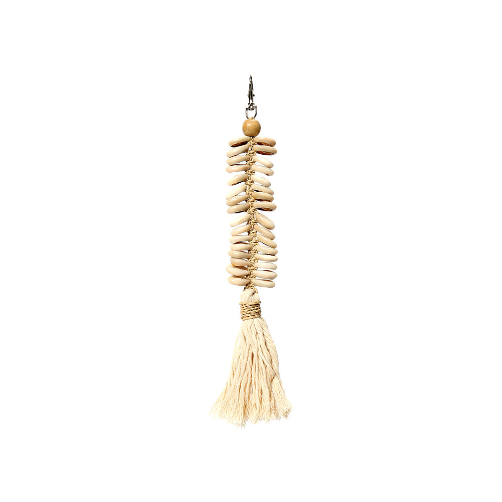 An ocean seashell keychain with a long cotton tassel charm in cream color, enriched with wooden beads that connect a metal lobster clasp.