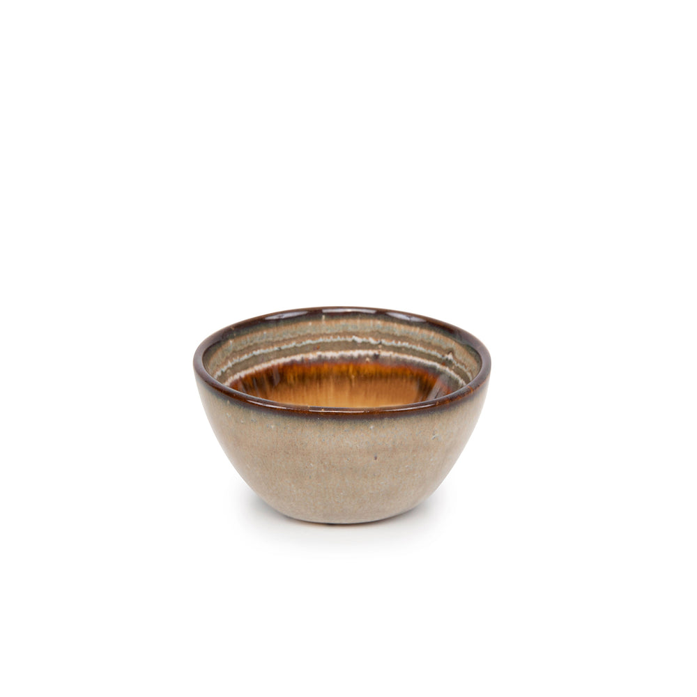 A dipping bowl with reactive glass in extra small size and earthy tone, handmade from stoneware in Portugal.