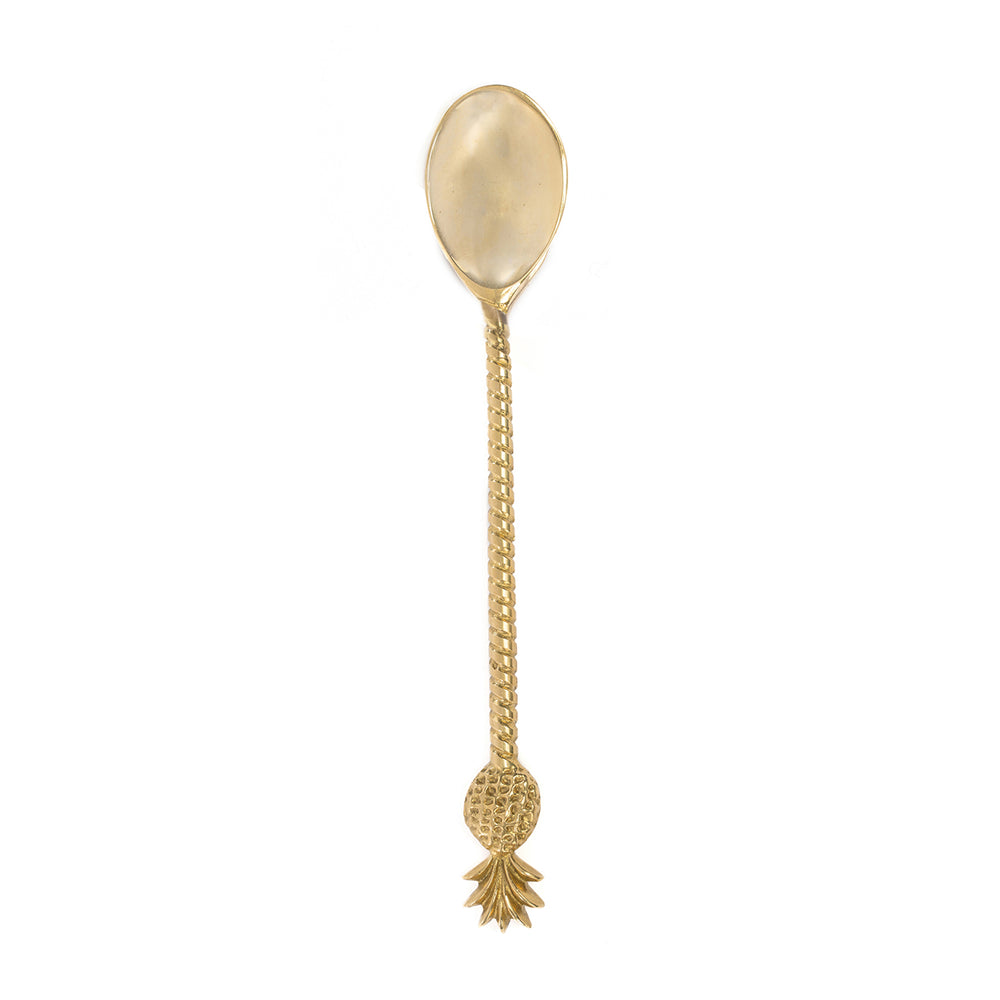 A brass spoon for dining with a twisted handle and pineapple accent in golden tone.