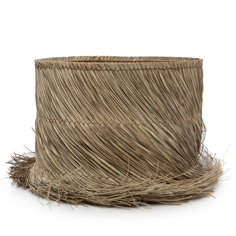 A pandan fibre lamp shade in natural color with inner iron ring support for lamp fitting, dressed with raw fringe.