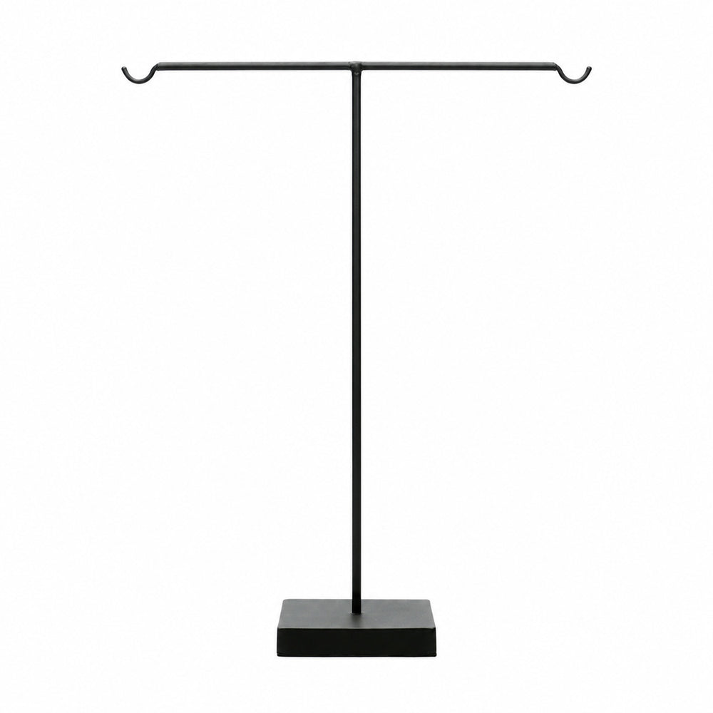 A tall tabletop display stands in a t-bar silhouette with a solid, weighted square base.