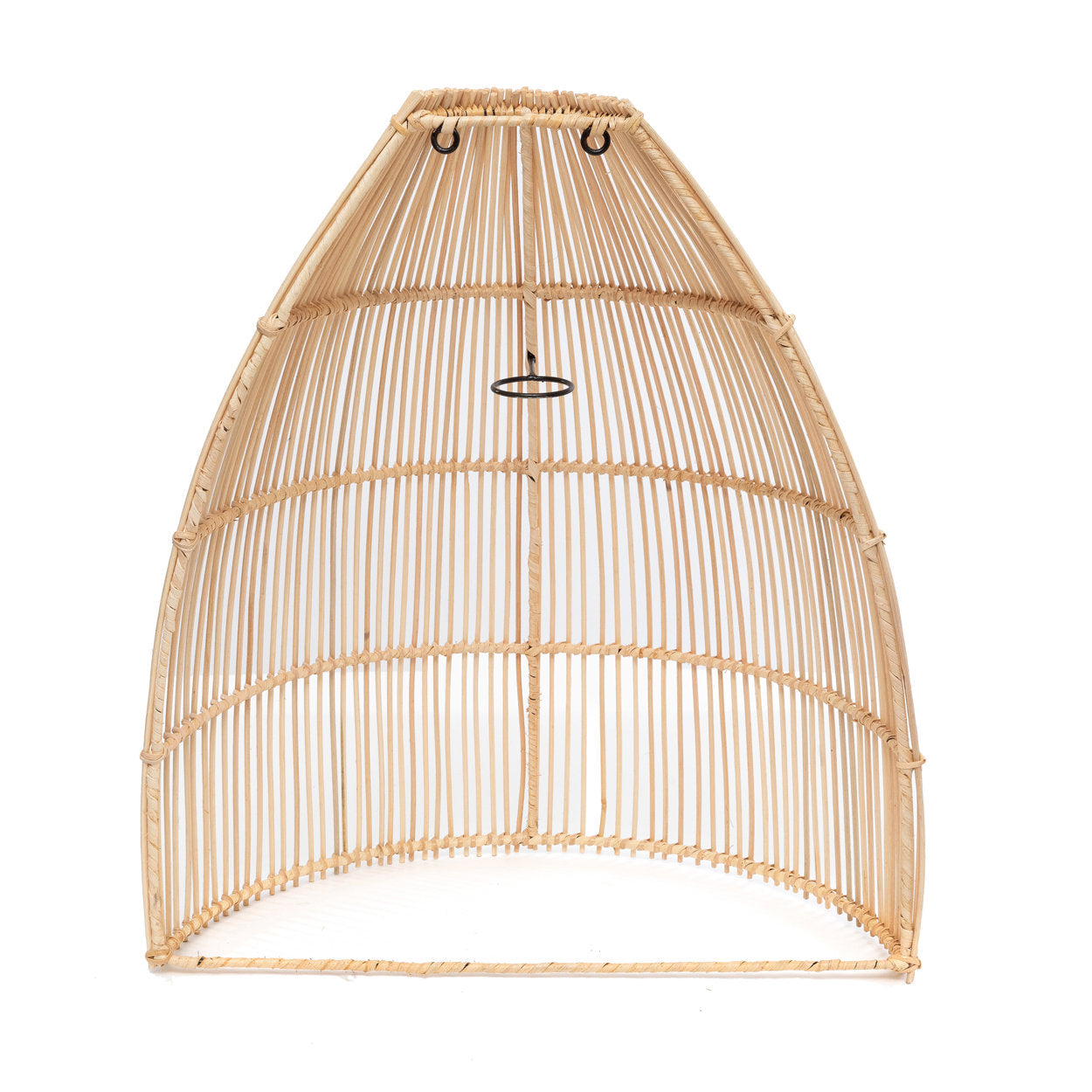 Soft ambient lighting from a boho-inspired rattan wall applique, creating a welcoming atmosphere in a reading nook.