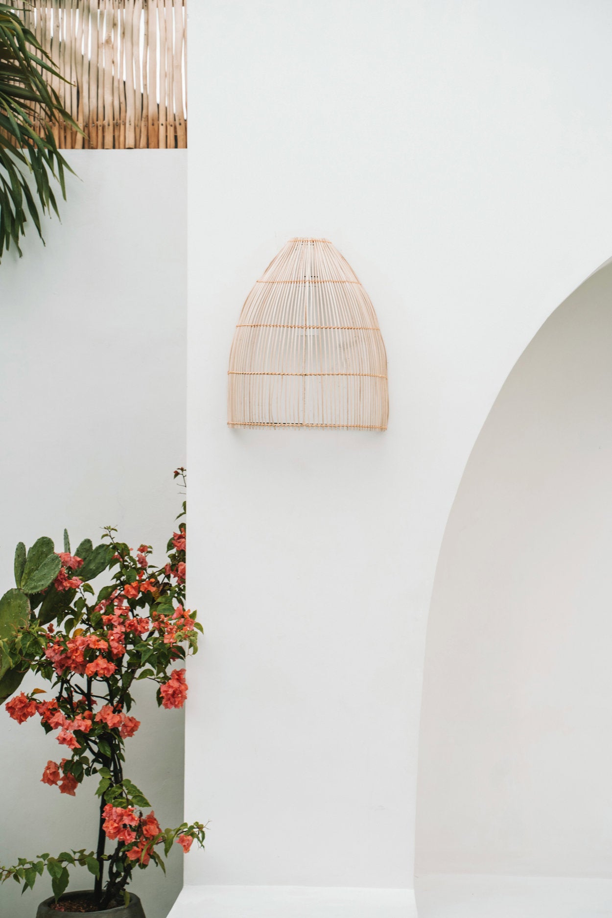The Lalo Wall Applique styled in a living room corner, complementing natural woods and neutral palettes for a relaxed, earthy feel.