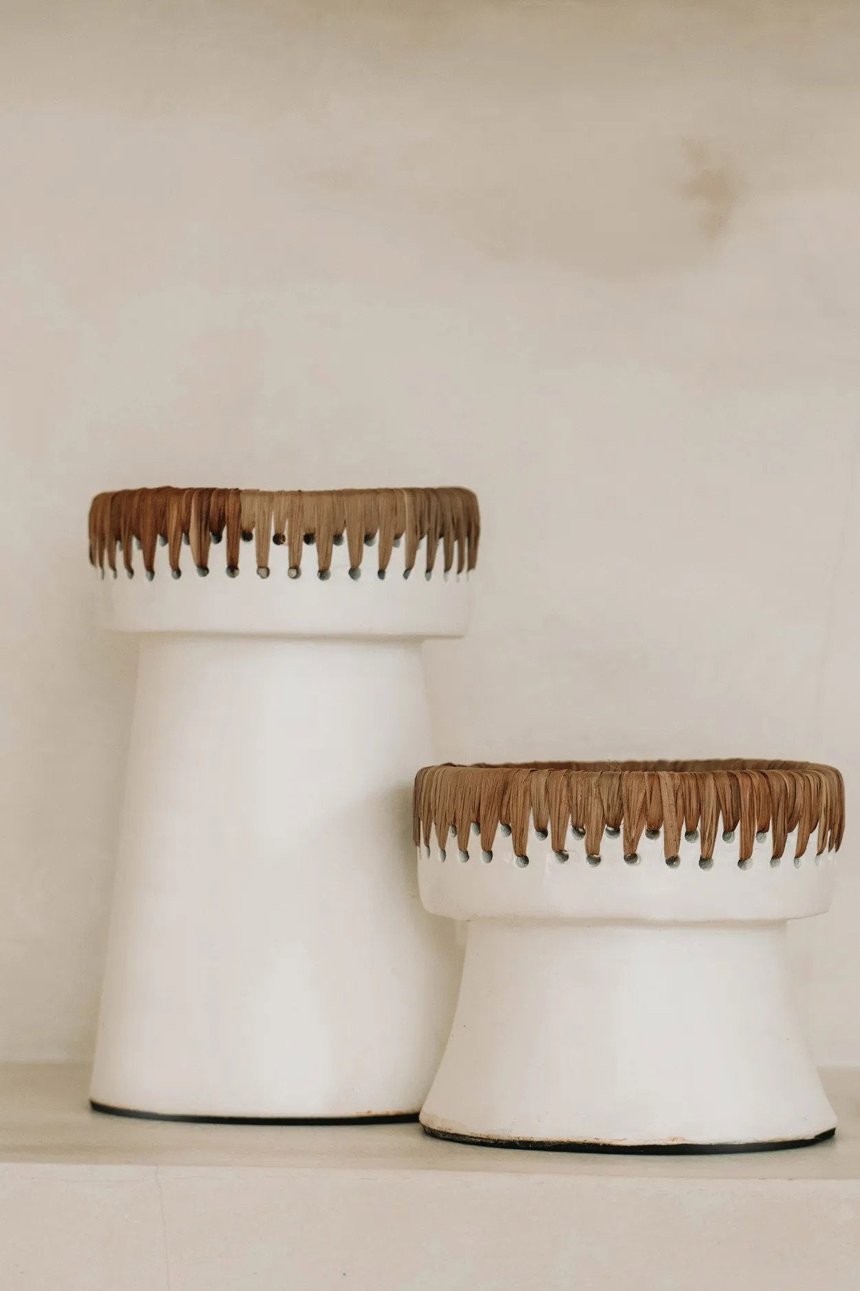 Soft white candle holder with organic texture and artisanal character
